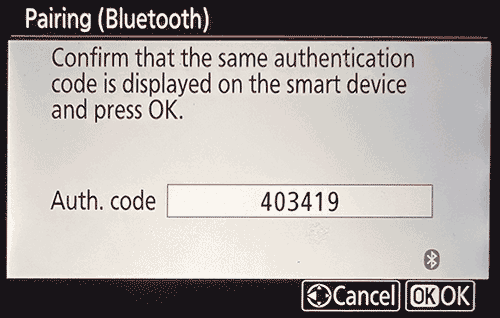 Camera screen asking you to confirm that the smart device displays the same authentication code, then press OK